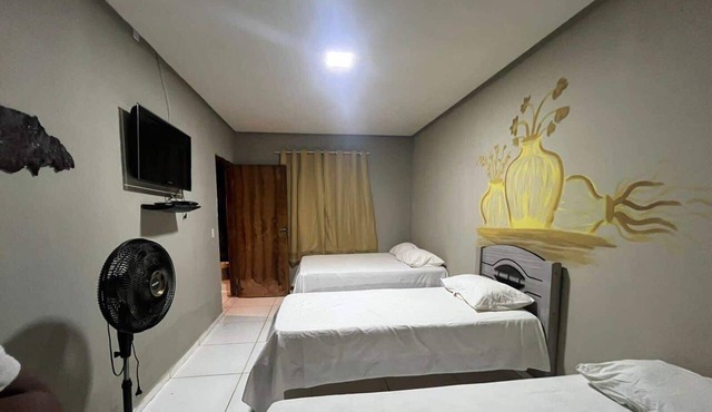 Suíte em Rio Grande com Cozinha e Piscina in Palmeiras