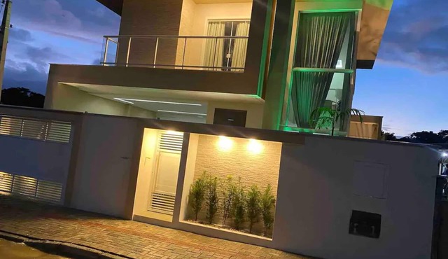 Two-story house with pool near beaches and Beto Carrero World theme park.