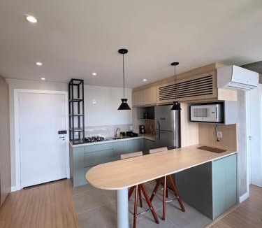 Rio Branco Apartment | Studio moderno, perto de tudo com garagem e ar