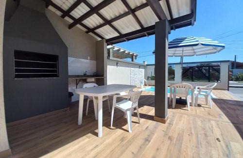 Capao da Canoa House | Casa com piscina, Ar condicionado, Pertinho Do Mar Em Capão Da Canoa