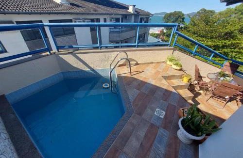 Canasvieiras Apartment | C133 Aconchegante cobertura em condomínio de frente para o mar na praia de Canasvieiras