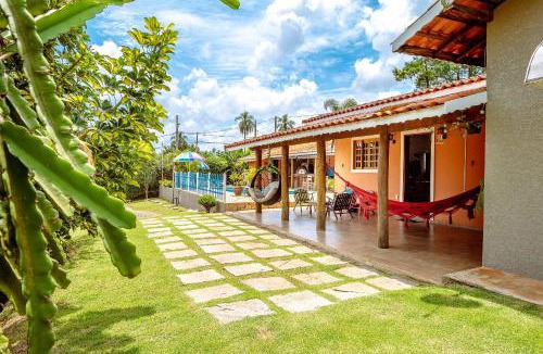 Atibaia House | Piscina Climatizada Fogão a Lenha Espaço Para Fogueira Churrasqueira Quartos aconchegantes